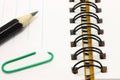 Open notepad with pencil and paper with clip Royalty Free Stock Photo