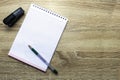 Open notepad for writing fountain pen and stapler on the table copy space Royalty Free Stock Photo