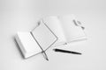Open notepads and pen for a make a plan on a white background