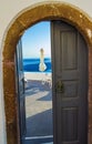 Open door to balcony with panoramic view to Aegean Sea Santorini Greece Royalty Free Stock Photo