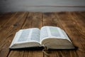 A open old bible on wooden background Royalty Free Stock Photo