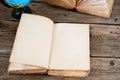 Open old book with blank pages on wooden table with globe close Royalty Free Stock Photo