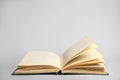 Open old hardcover book on grey background. Space for text Royalty Free Stock Photo