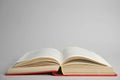 Open old hardcover book on grey background. Space for text Royalty Free Stock Photo