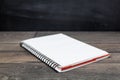 Open orange notebook on wood Royalty Free Stock Photo