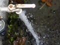 Open outdoor water tap close up