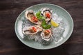 Open oyster stuffed with papper and lemon Royalty Free Stock Photo