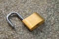 Open padlock, placed on the ground Royalty Free Stock Photo