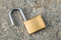 Open padlock, placed on the ground Royalty Free Stock Photo