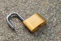 Open padlock, placed on the ground Royalty Free Stock Photo