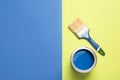 Open paint can, brush and space for text on color background Royalty Free Stock Photo