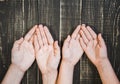 Open palms of female and child`s hands