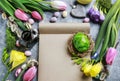 Open paper notebook, colorful flowers and easter eggs