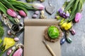 Open paper notebook, colorful flowers and easter eggs