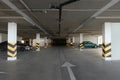 Open parking garage with cars and empty slots