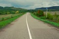 An open paved road leads into the distance.A dirt road in a forest thicket.the concept of Royalty Free Stock Photo