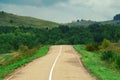 An open paved road leads into the distance.A dirt road in a forest thicket.the concept of Royalty Free Stock Photo