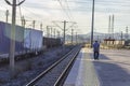 Open perspective shot of farmer at railway station