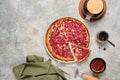 Open pie, shortcrust pastry tart stuffed with cranberries and sour cream filling on a ceramic plate on a gray concrete background Royalty Free Stock Photo