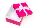 Open pink box with a gift and white bow isolated Royalty Free Stock Photo
