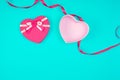 open pink heart-shaped gift box with a bow on a blue background Royalty Free Stock Photo