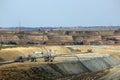 Open pit coal mine with excavators and machinery Royalty Free Stock Photo