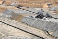 Open pit coal mine with machinery Royalty Free Stock Photo