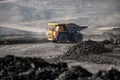 Open pit mine industry. Big yellow mining truck for coal moving on road career Royalty Free Stock Photo