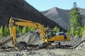 Excavator in the mountains of Eastern Siberia / Earthworks / Mining Royalty Free Stock Photo
