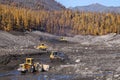 Bulldozers and Wheel Loaders in the mountains of Eastern Siberia / Earthworks / Mining Royalty Free Stock Photo