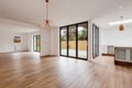 Open plan sitting room with bifold patio doors