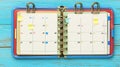 Open planner, appointments, sticky notes, wood, scheduling, planning Royalty Free Stock Photo