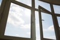 Open plastic window at the background of blue sky Royalty Free Stock Photo
