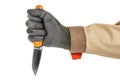 Open pocket folding knife with bright orange handle clenched in a man fist in black protective glove isolated on white background Royalty Free Stock Photo