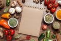 Open recipe book and ingredients on wooden table, flat lay. Space for text Royalty Free Stock Photo