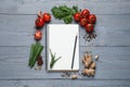Open recipe book and fresh products on wooden table, flat lay. Space for text Royalty Free Stock Photo