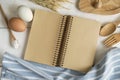 Open recipe book on white wooden table Royalty Free Stock Photo