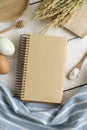 Open recipe book on white wooden table Royalty Free Stock Photo