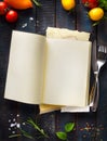 Open recipe book on wooden backgroun Royalty Free Stock Photo