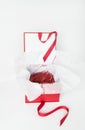 Open Red Box with White Tissue Paper Filled with Red Paper Strips Royalty Free Stock Photo