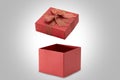 Open red gift box on gray background Royalty Free Stock Photo