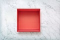 Open red gift box on natural marble background. Cardboard box on natural marbe texture Royalty Free Stock Photo