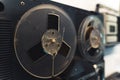 Open-reel recording concept. Closeup indoor shot of authentic vintage reel to reel tape recorder and player. Blurred Royalty Free Stock Photo