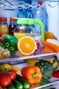 Open refrigerator filled with food Royalty Free Stock Photo