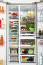 Open refrigerator full of fresh products Royalty Free Stock Photo