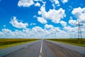 Open road beneath a brilliant blue African sky