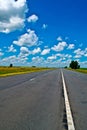 Open road beneath a brilliant blue African sky