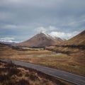 Open road leading through the Scottish Highlands of Glen Coe Royalty Free Stock Photo