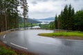 Open road. Down a bendy, curvy road. Empty road with no traffic in countryside on rainy day. Rural landscape. Ryfylke scenic route Royalty Free Stock Photo