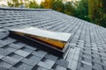 Open roof window on shingles flat polymeric roof-tiles Royalty Free Stock Photo